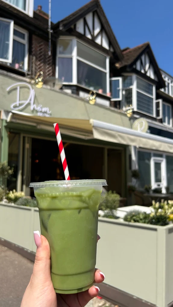 Iced matcha drink outside Dhöm Bistro